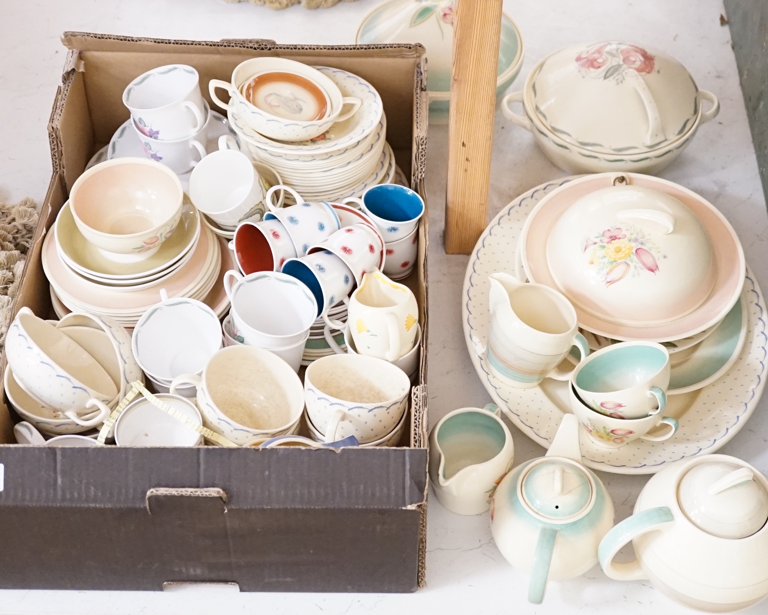 A collection of Susie Cooper ceramics and tablewares including tureens, an oval platter, cups and saucers